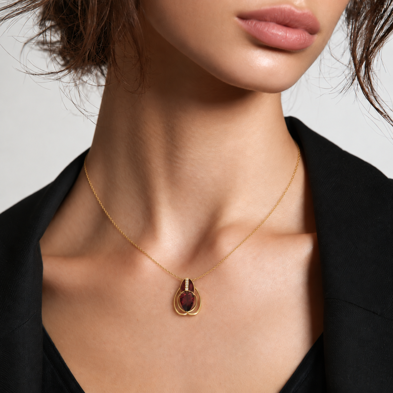 Model wearing a garnet pendant